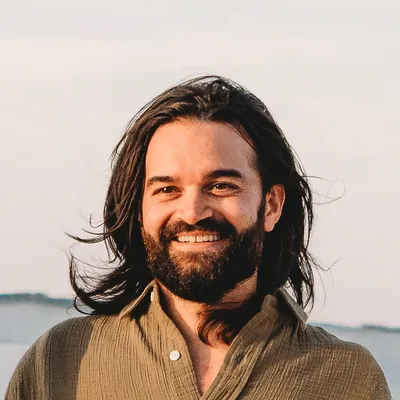 Zach Sekar smiling at the beach